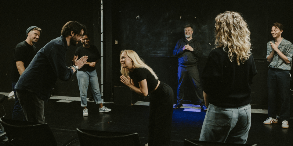The Pretend Company warm up before a show.