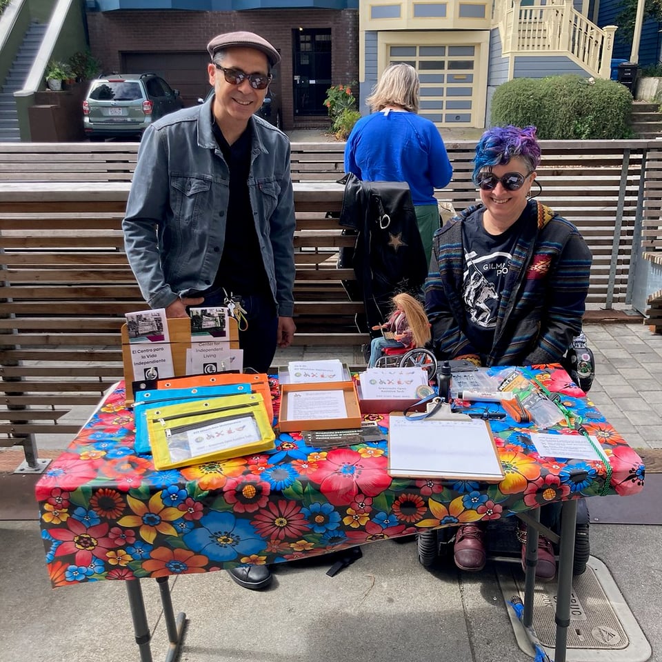 Vince and Liz, in sunglasses, behind our GOAT and ILRCSF table for Earth Day