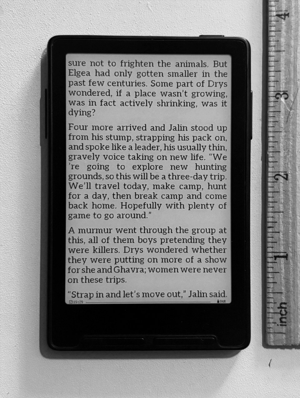 Photo of e reader with ruler for scale