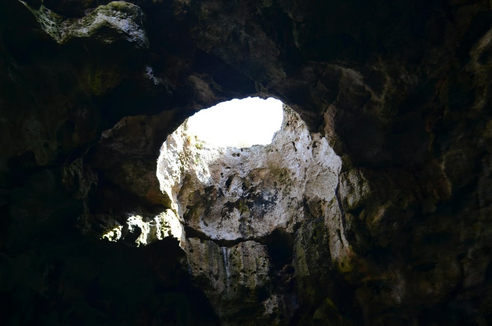 Looking upward, from a hole in the ground. Photo by Marie François on Unsplash.