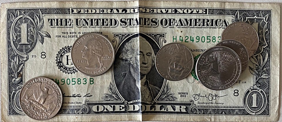 A photograph of not very much American currency, the average cost of a healthy diet