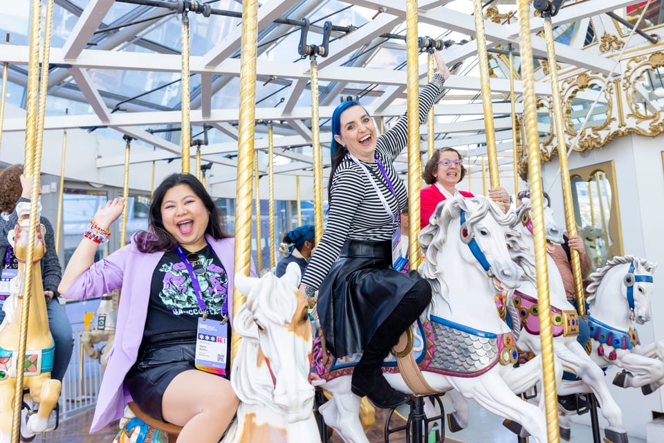 Riders on the LeRoy King Carousel.