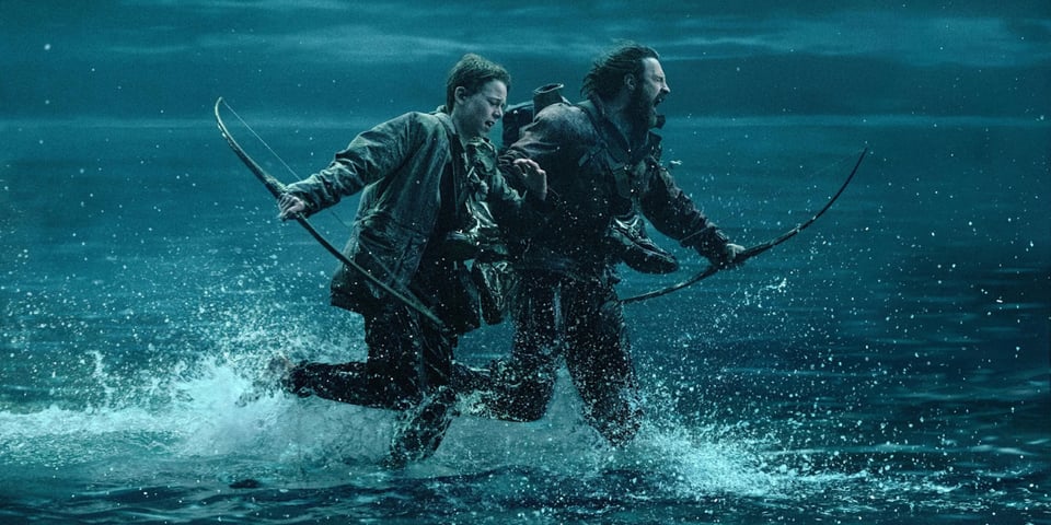 Two men run screaming across a causeway.