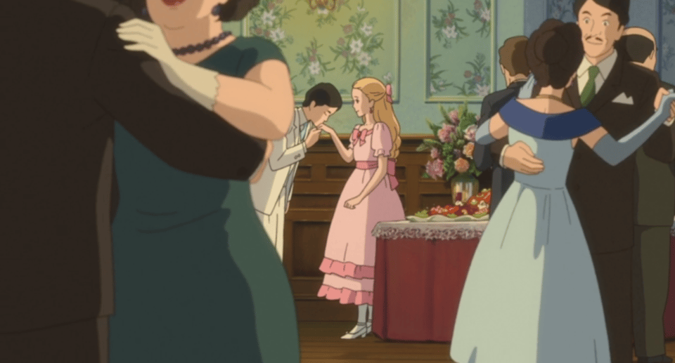 Marnie's future husband kisses her hand.