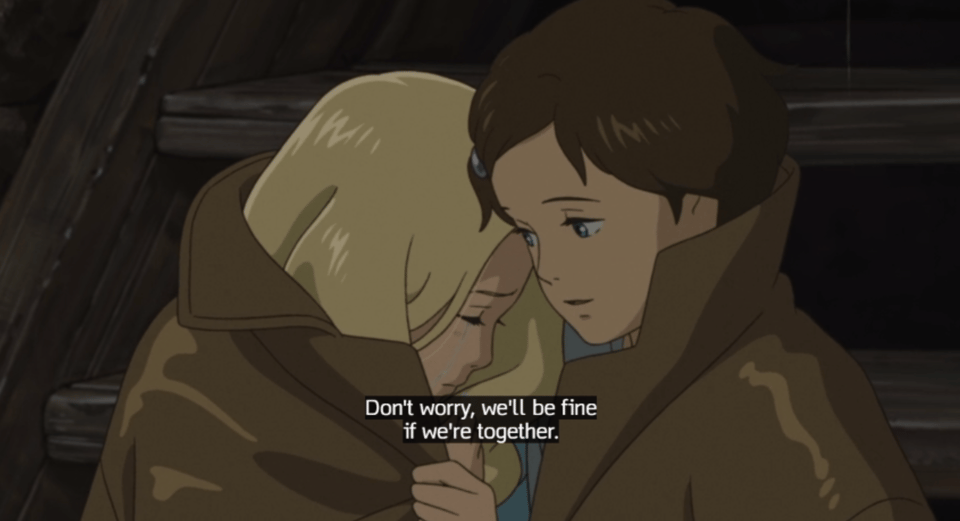 Anna and Marnie huddle together in the jacket. Anna is saying,