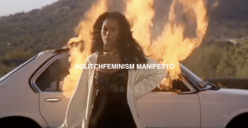a photo of a woman dressed in cocktail attire walking away from an exploding car, with the words "hashtag glitch feminism manifesto" overlaid in bold text