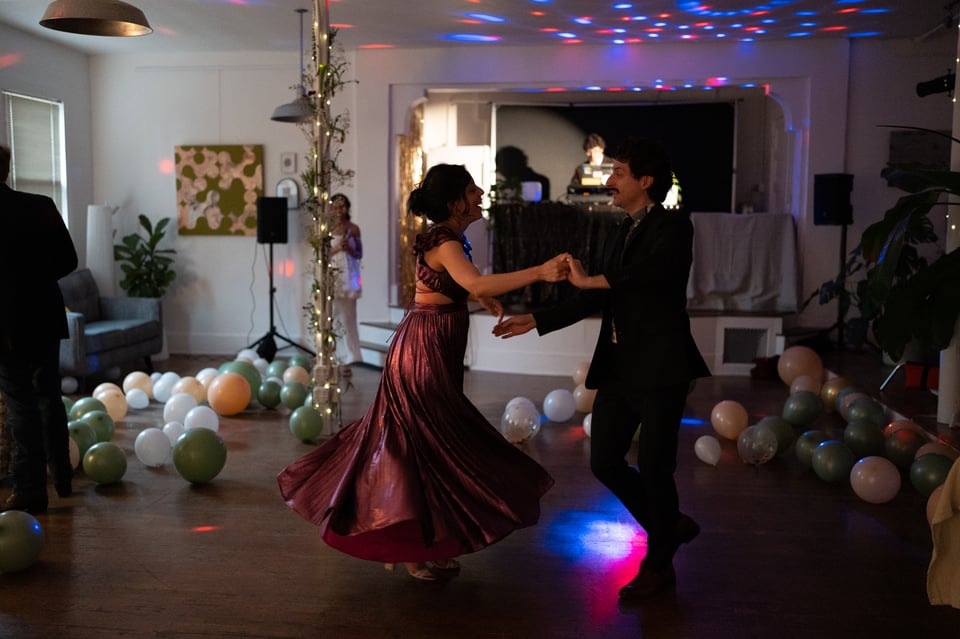 Ivan and Rebeca salsa dancing.