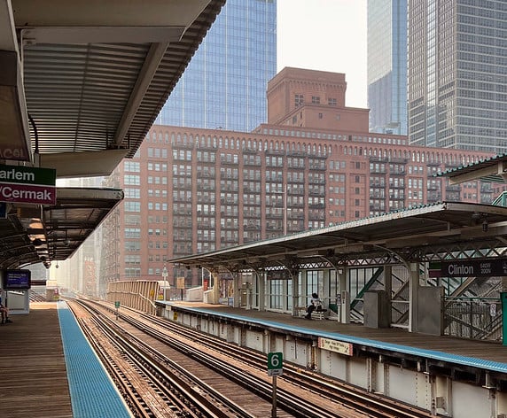 Image of Chicago T station with track receding into distance, early morning