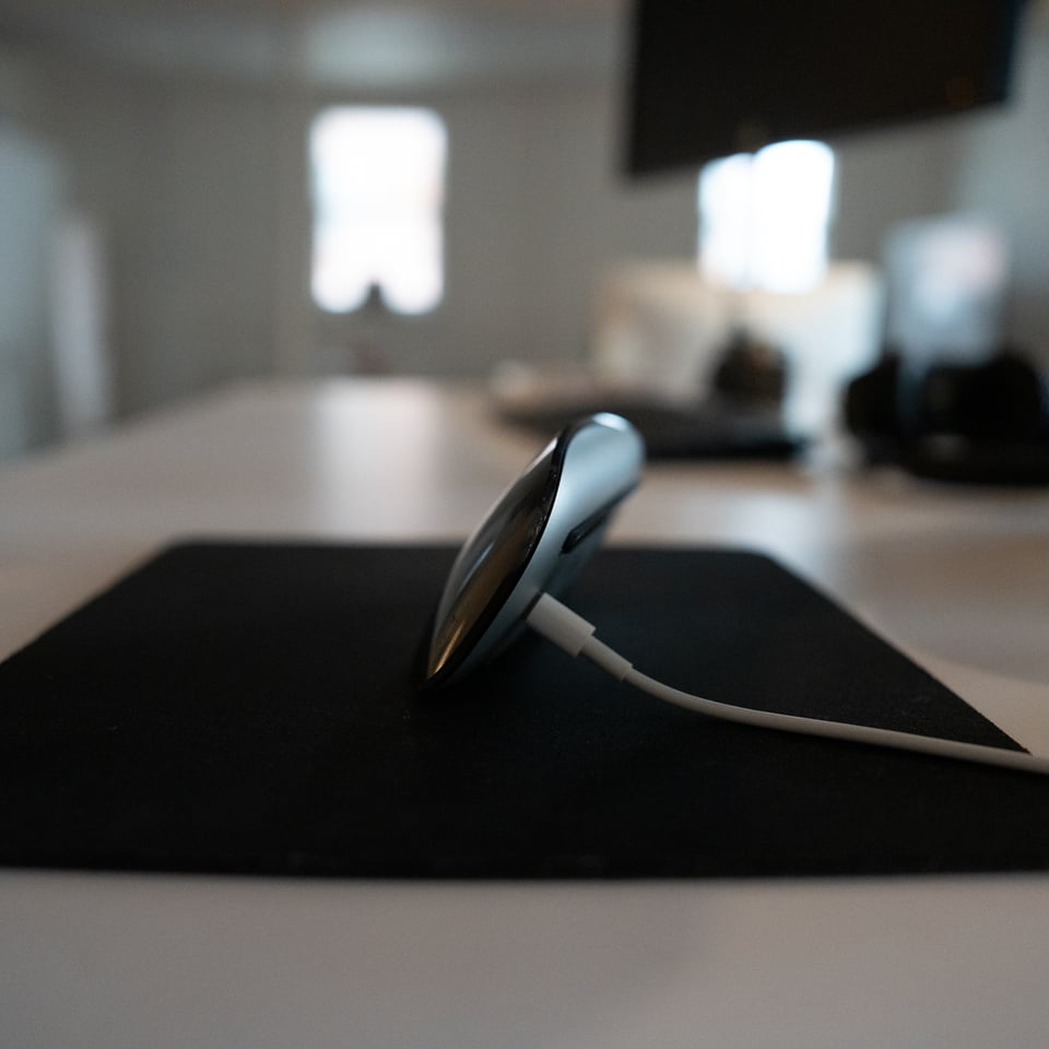 An Apple Magic Mouse charging.