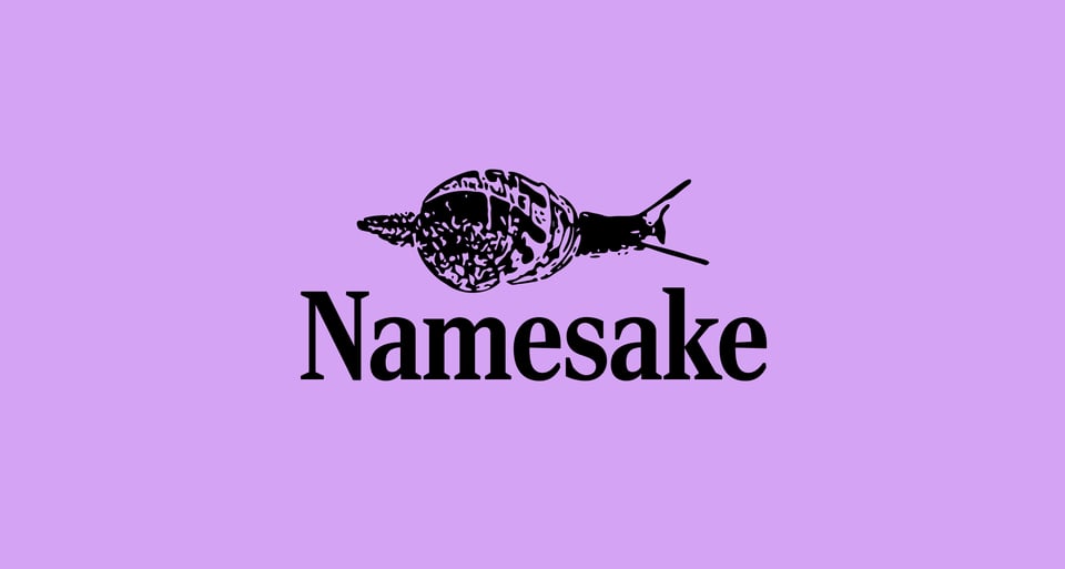 A snail in the style of a photocopy sits atop the word "Namesake" written in a condensed serif font, on a purple background