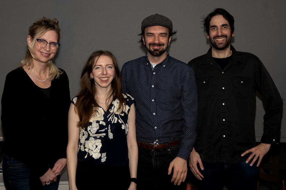 Four people stand facing the camera and smiling. Left to right: Carolyne Van Der Meer, Willow Little, Matthew Rettino, and Jerome Ramcharitar.