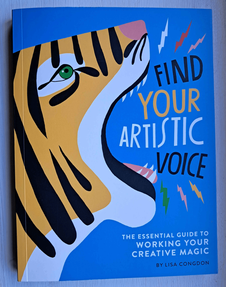 picture of the book "Find your artistic voice" by Lisa Congdon. There is a tiger roaring the title on the cover.