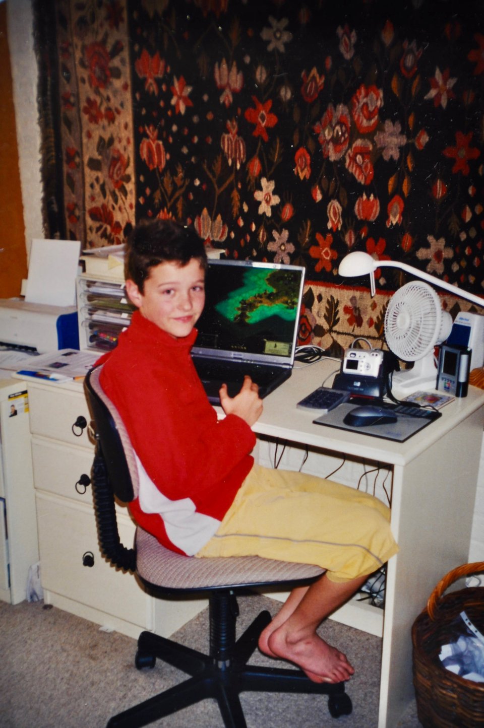 Me in 2005ish (age approximately 13) playing Civilization III on a laptop.