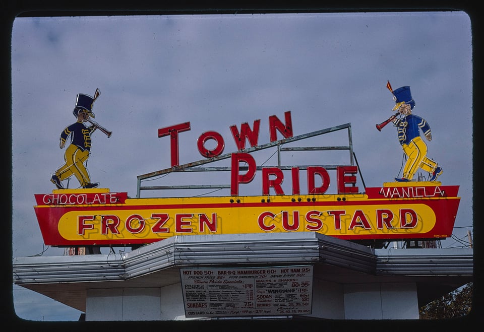 Town Pride, Frozen Custard - chocolate or vanilla. An American illuminated sign, above a diner.