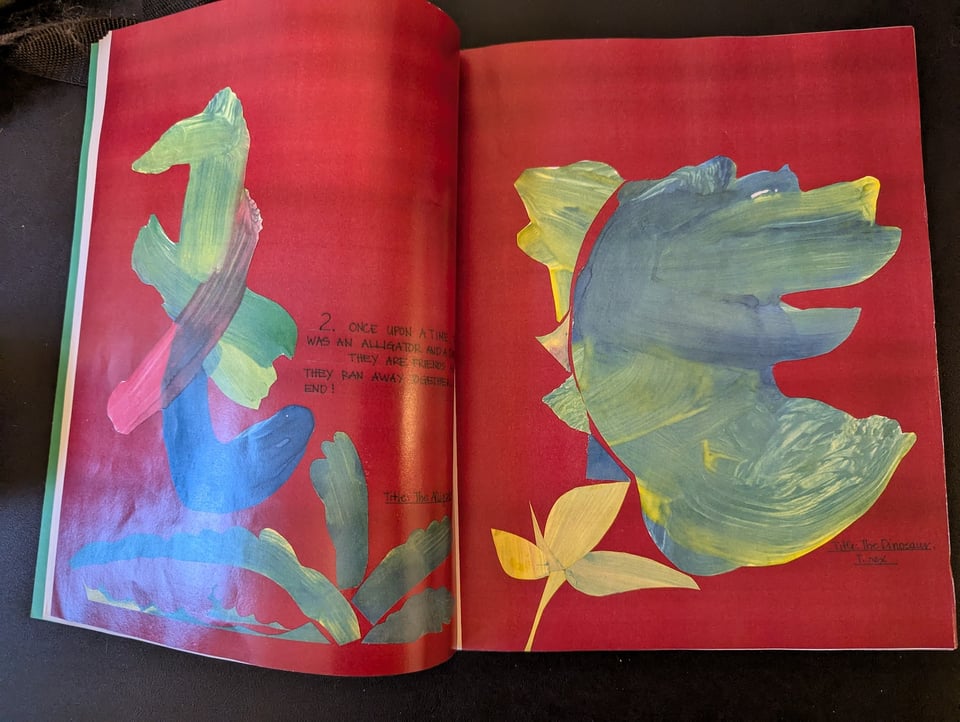 A child's rendition of an alligator and dinosaur