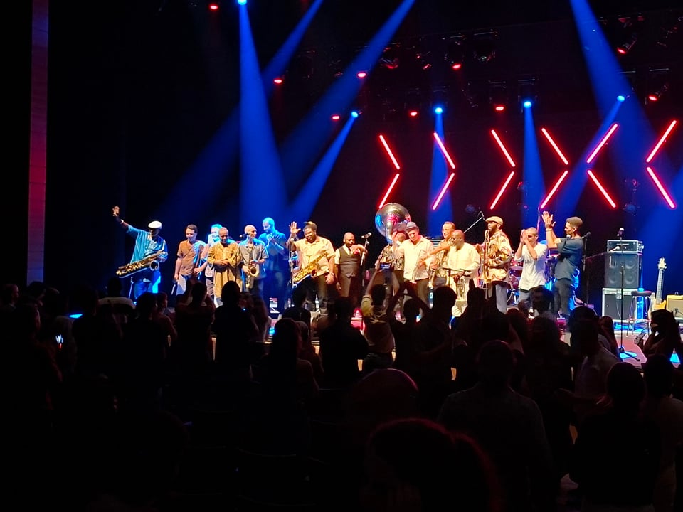 Musicians from both bands on stage together for jam ensemble encore