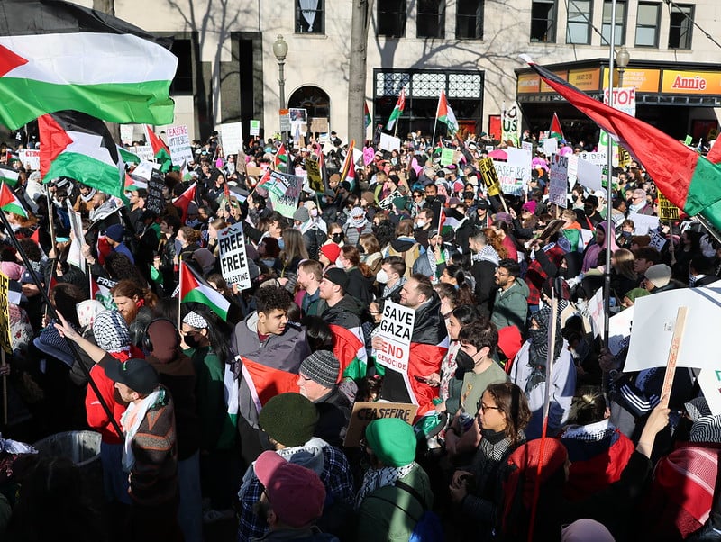 People marching on the street in a Save Gaza Parade