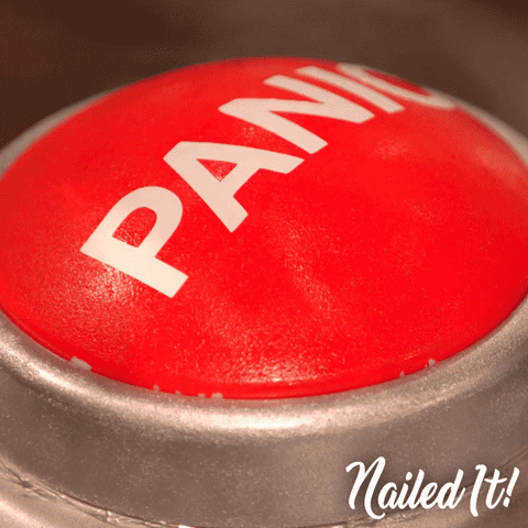 a white person's hand hitting a red button labeled "panic"