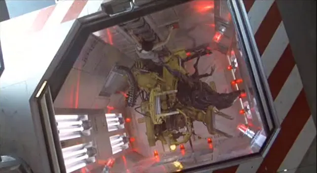 The alien queen and Ripley tumble into the bottom of the spacelock. Ripley tries to climb the ladder but the alien queen has a hold of her shoe.