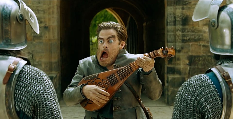 A scene from Dungeons and Dragons: Honor Among Thieves; a magical construct of the bard played by Chris Pine isn't going well and his face is becoming comically distorted.