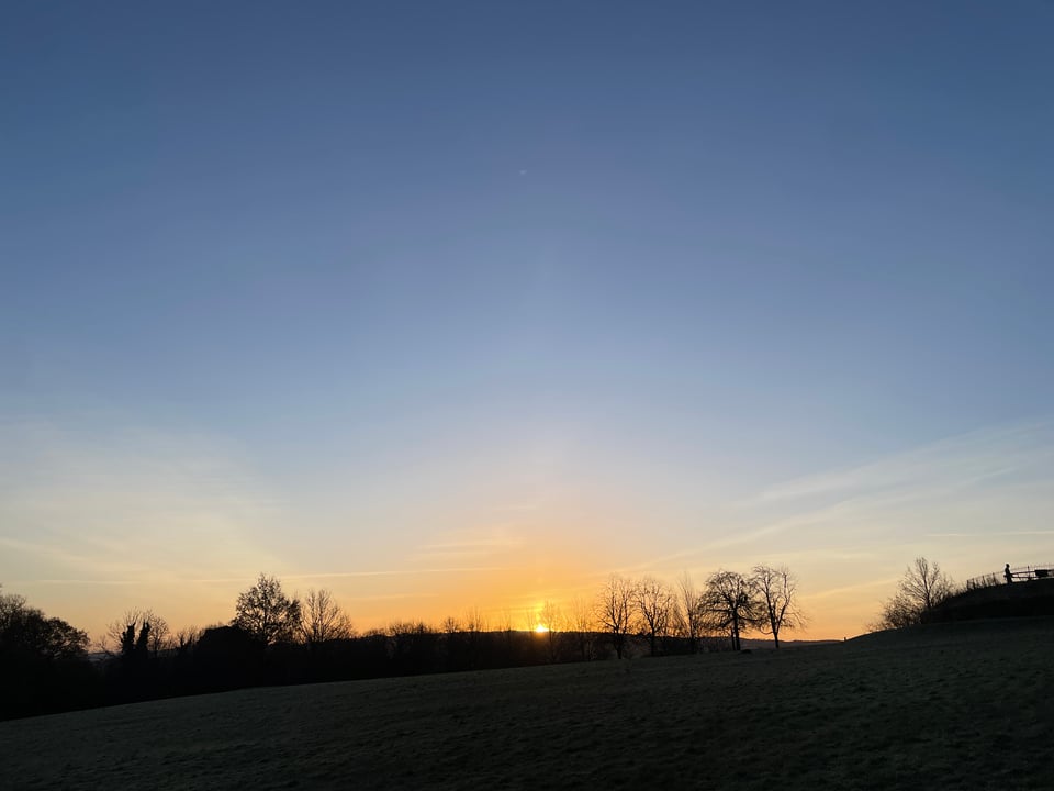 image of a sunrise over a park