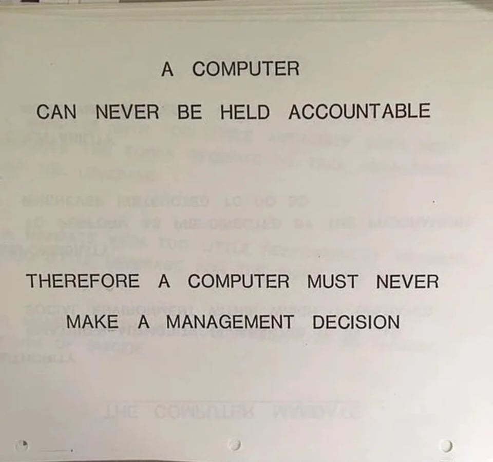 Screenshot from an IBM manual from 1979. The text is all capital letters of a size and spacing to cover the entire page for emphasis: "A computer can never be held accountable. Therefore a computer must never make a management decision"