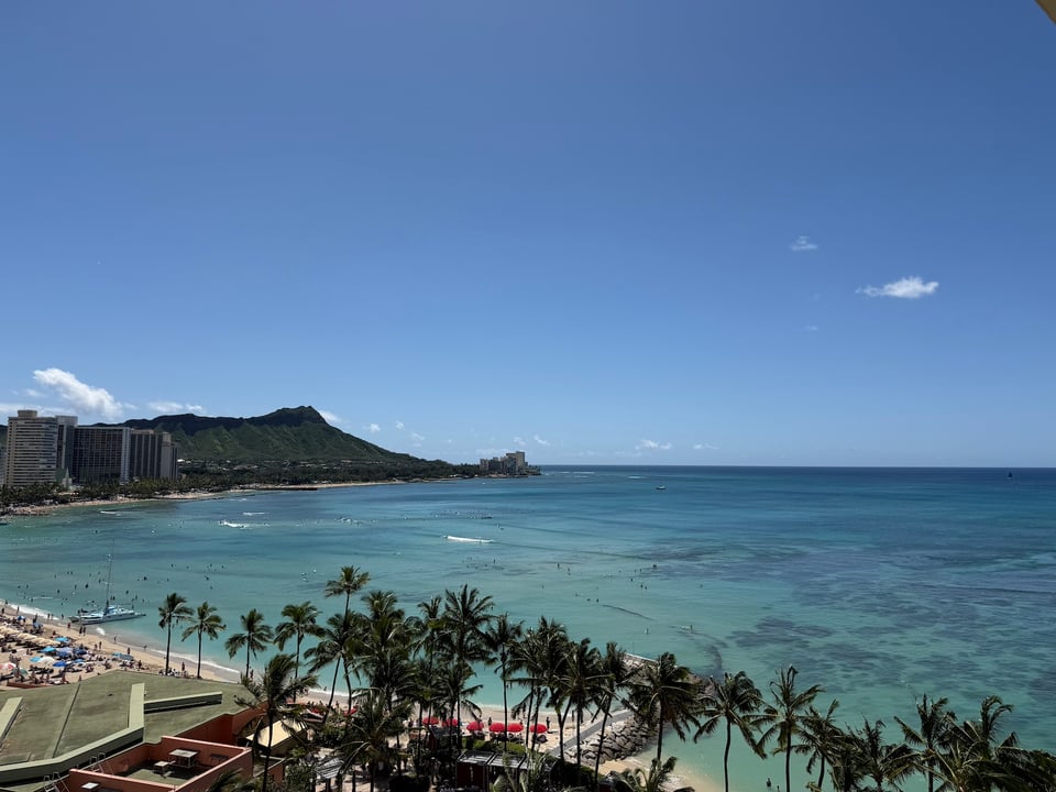 a view from the 10th floor of a hotel on Waikiki Beach and Diamond Head, Oahu, Hawai'i