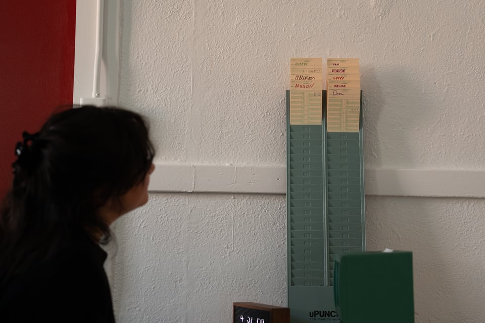 Livvy admiring the new time card holder.