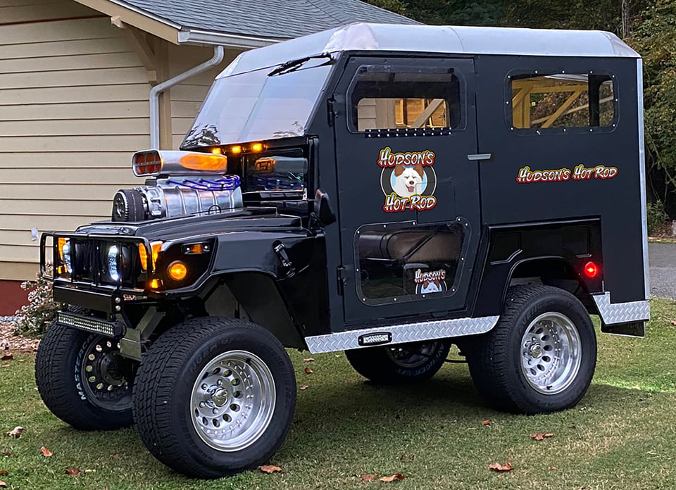 The finished golf cart. It says Hudson's Hot Rod on the side.