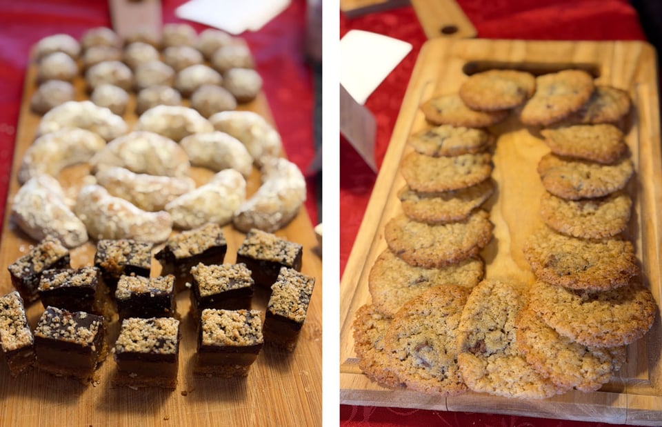 Two trays of holiday cookies with four different types.