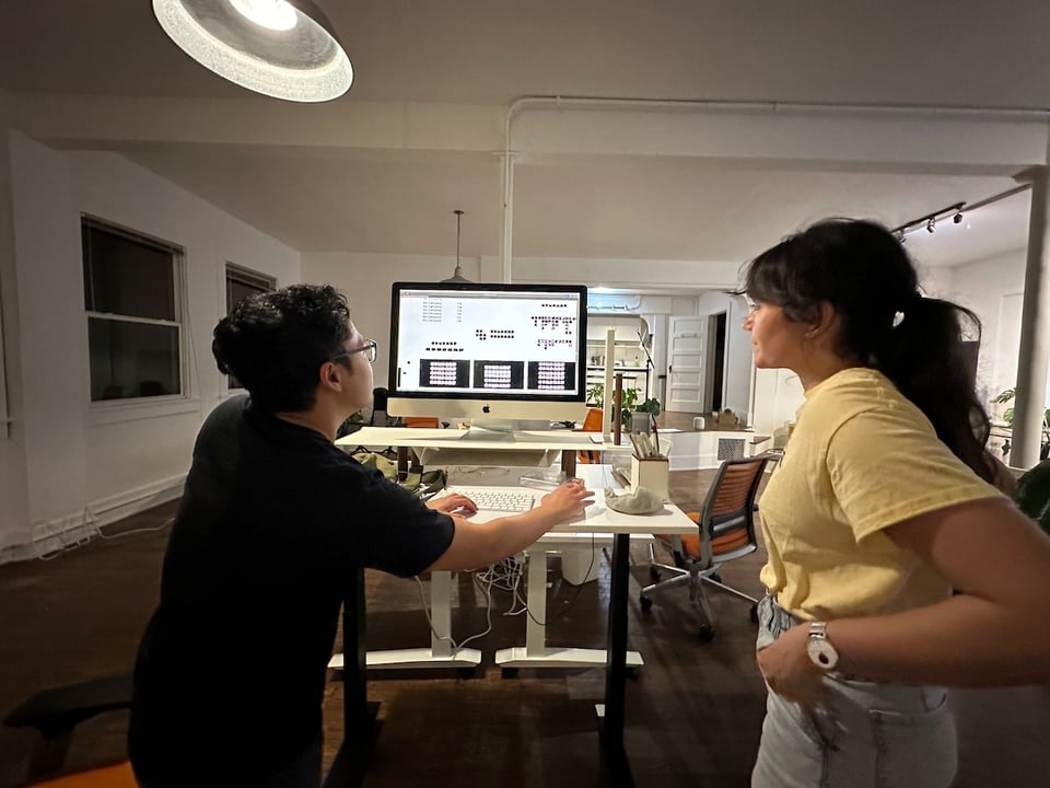 us looking at a screen with logo options