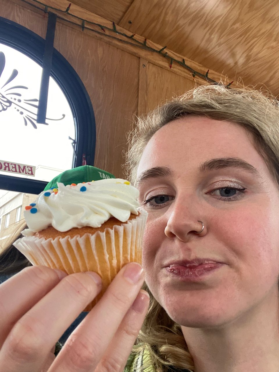 a woman eating a cupcake