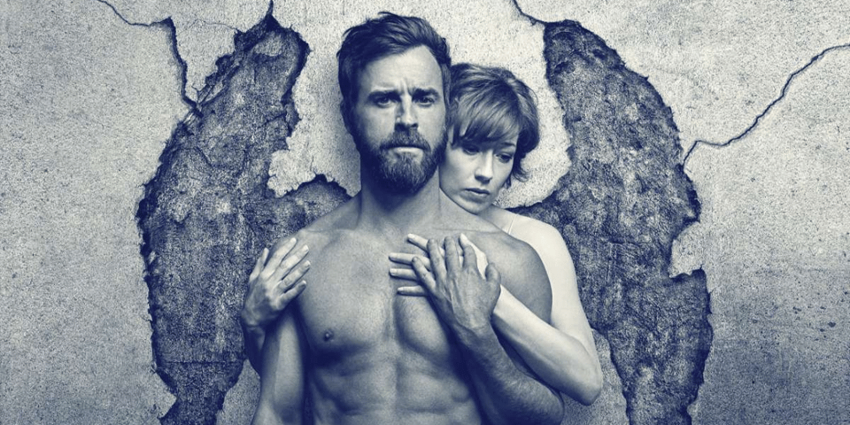 Two people embrace with the crack in the wall behind them looking like angel wings.