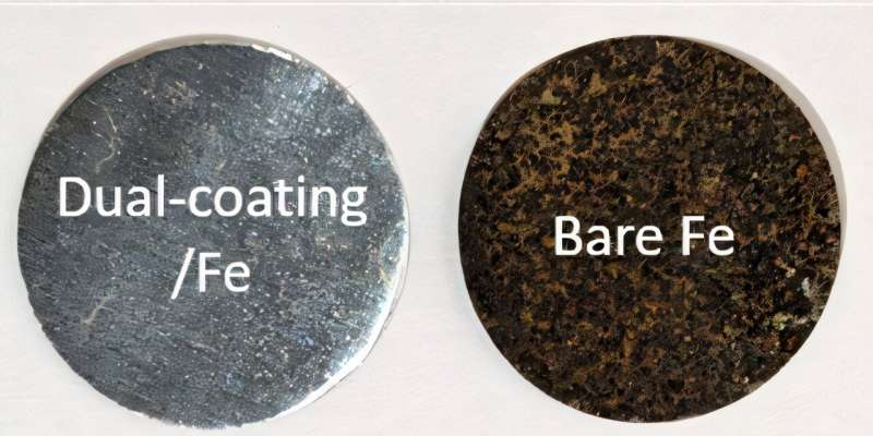 Two discs of iron. On the left is the iron with the dual coating, and it is a silvery gray color. On the right is bare iron, and it is the orangey brown color of rust.