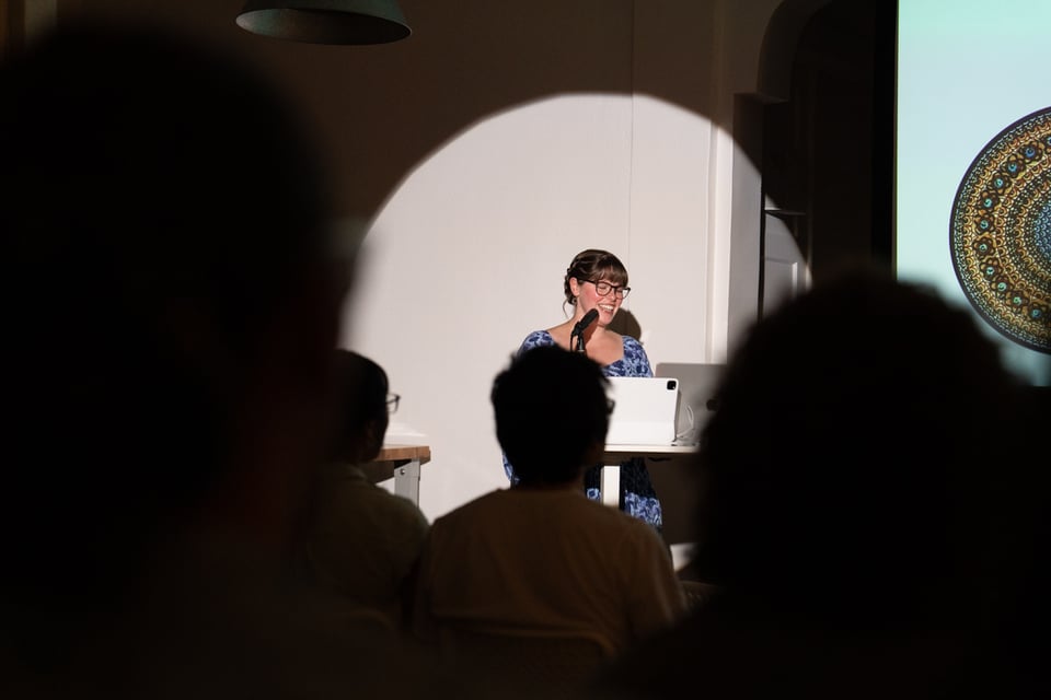 A different woman presenting a different presentation.