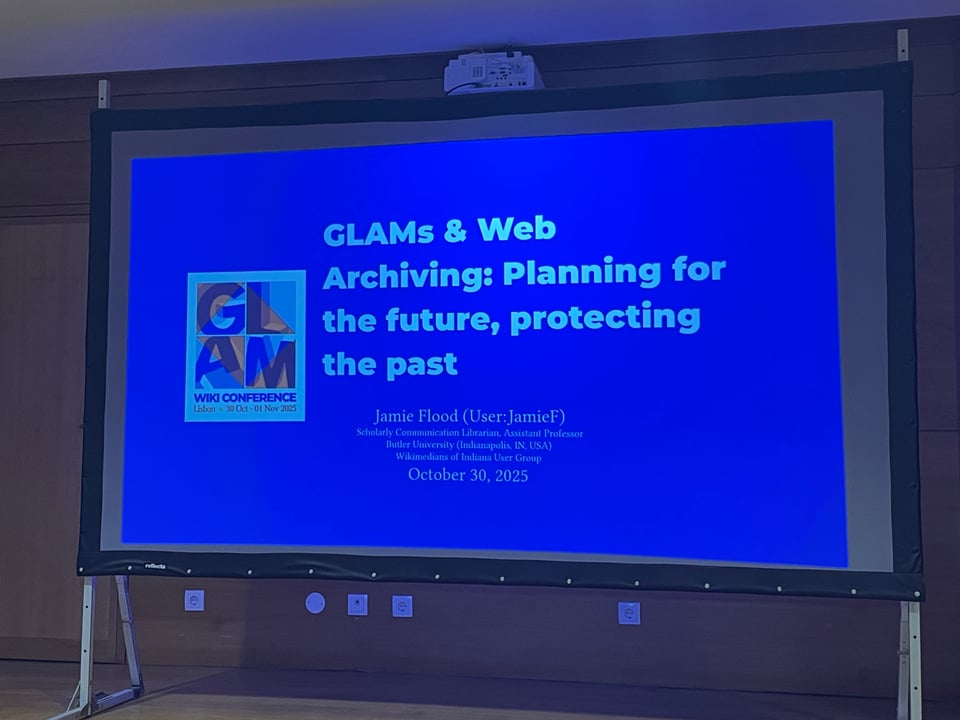 A presentation on a screen of "GLAMs & Web Archiving: Planning for the future, protecting the past"