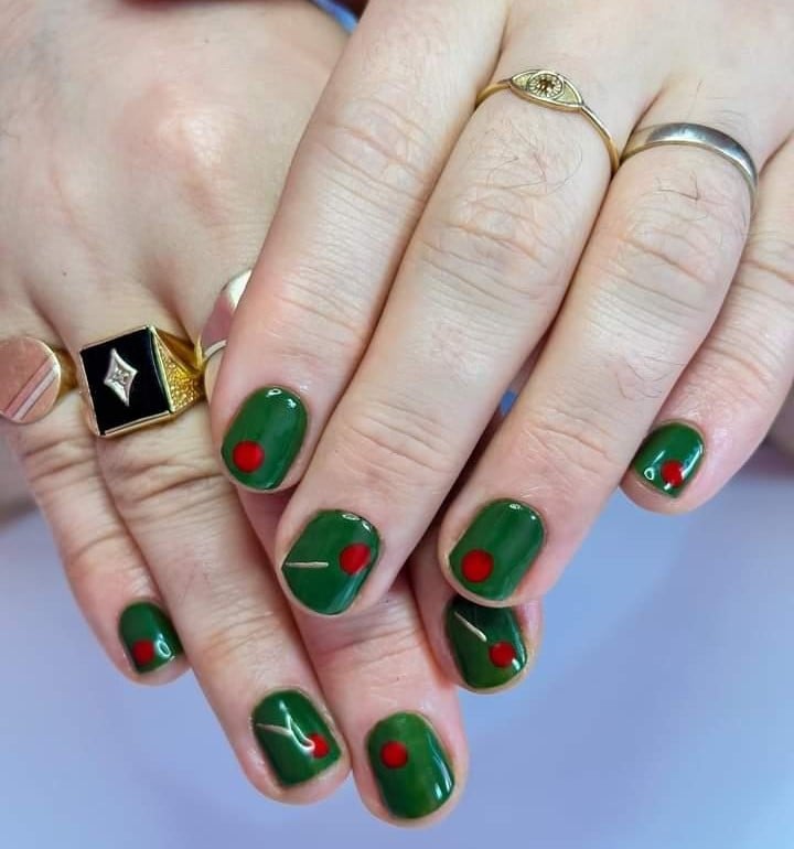 A manicure that looks like martini olives.