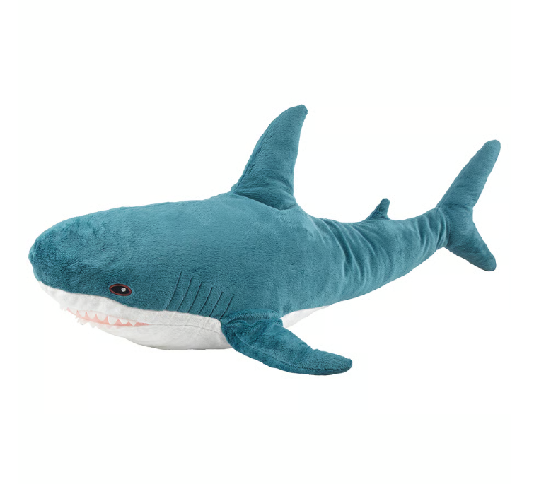 photo of an Ikea BLÅHAJ shark. A stuffed toy shark, with a blue body and a white underside, and a cheeky toothy shark grin