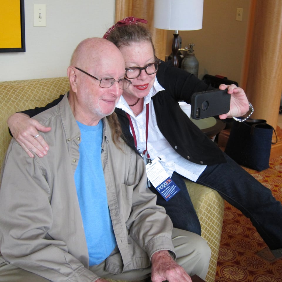 2014 photo of cartoonist Lynda Barry taking a selfie with Jules Feiffer