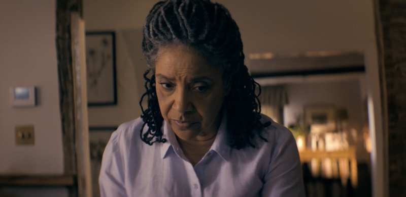 Rashas looking nervously at her computer screen while dealing with scammers