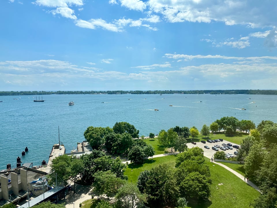 Photo of the view from a Toronto hotel room beside Lake Ontario, with lots of boats in the water