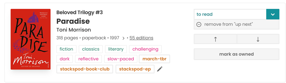 StoryGraph book page for "Paradise" by Toni Morrison, labelled as Beloved Trilogy #3. Shows the book cover, metadata (318 pages, paperback, 1997, 55 editions), community genre and mood tags (fiction, classics, literary, challenging, dark, reflective, slow-paced), a custom "march-tbr" tag in orange, custom tags "stackspod-book-club" and "stackspod-ep," and action buttons including "to read" status, "remove from up next," reorder arrows, and "mark as owned."
