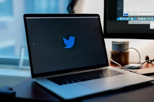 a laptop with the twitter logo on it