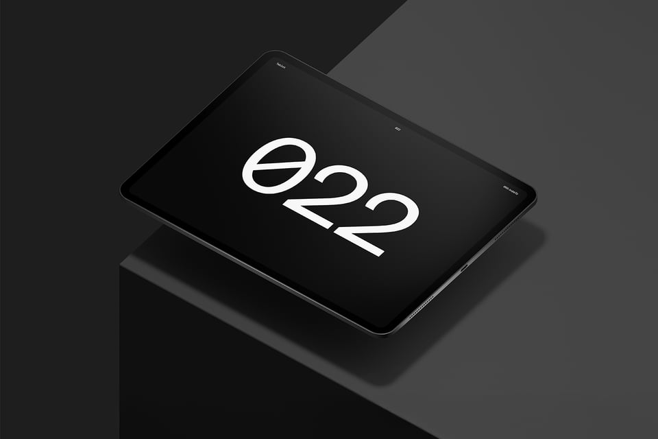 Floating tablet device above a solid cube