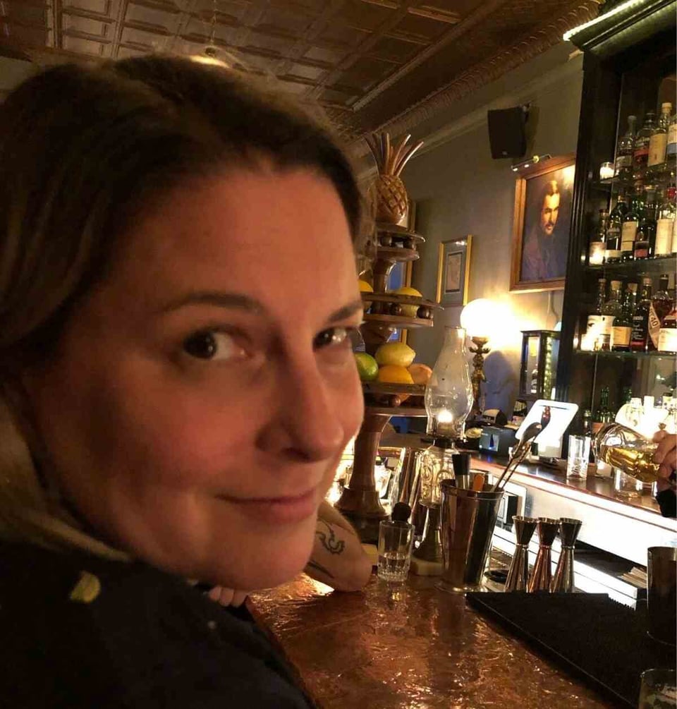 A close-up profile of a woman's face in a bar (Gigantic, in Easthampton, as it happens).
