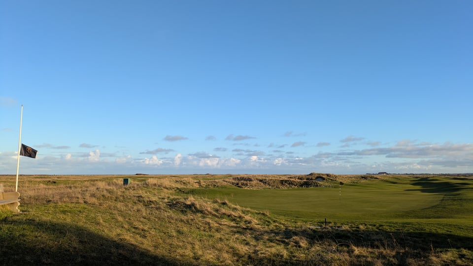 Finishing hole at Prince's from the back of the green in late afternoon sun