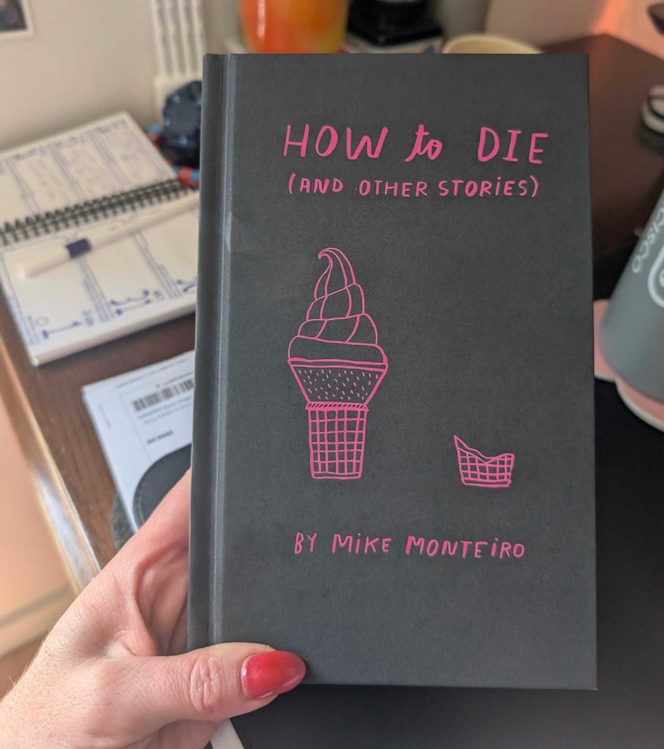 My friend Milly’s well-manicured hand holding a test copy of my new book!