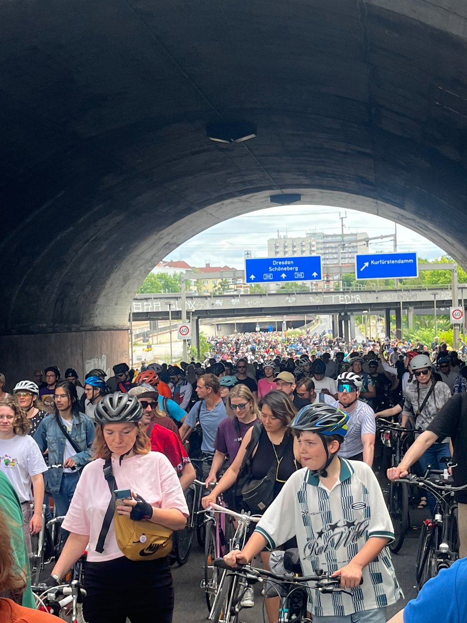 An autobahn highway and tunnel filled completely with cyclists