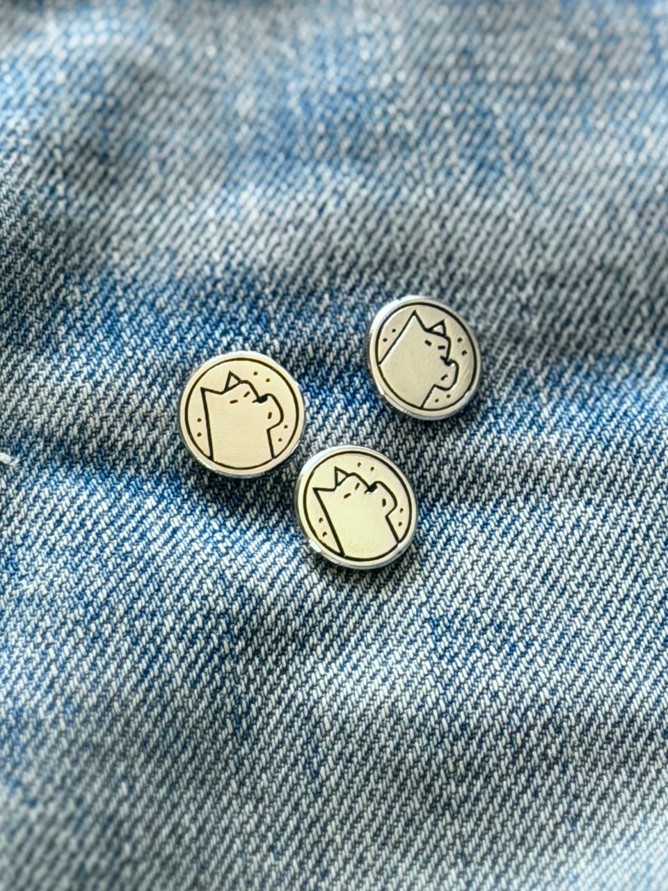 some enamel dog pins