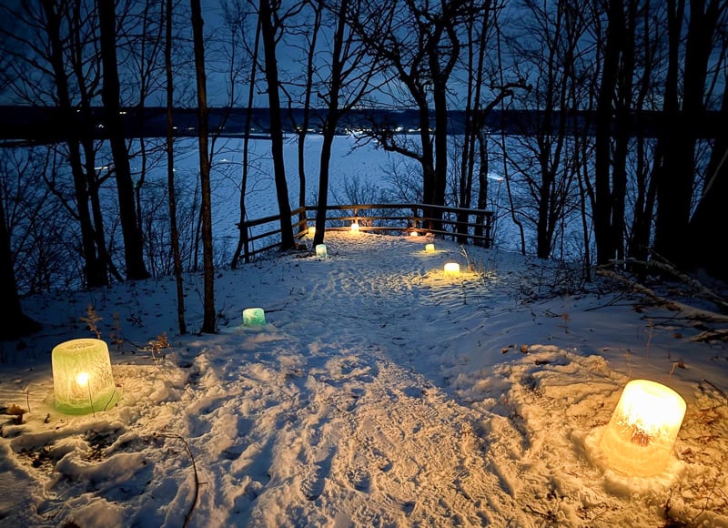 Ice luminaria lit the way along the blufftop trail on Feb. 8, CandleNight. Far below the trail, down on Lake Pepin, many an angler’s tent was lit up, too. So peaceful and pretty. / Photo by Nathan Oppedahl